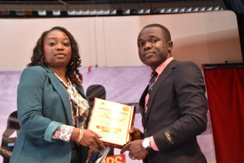 CEO Rave Television, Agatha, receives her award