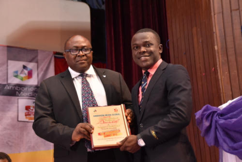 Mr Ayileka receives award on behalf of his Group MD, at Summit 2.0